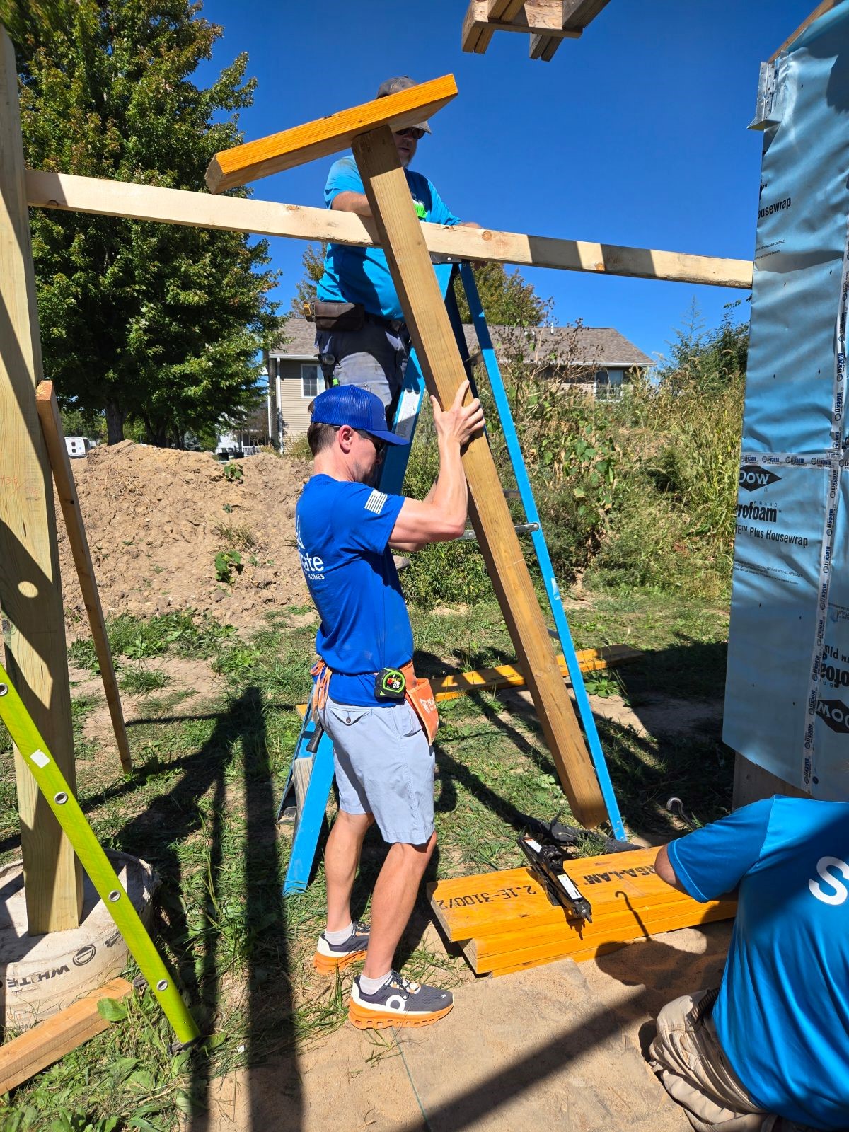 Navigate Homes volunteers assembling exterior framing